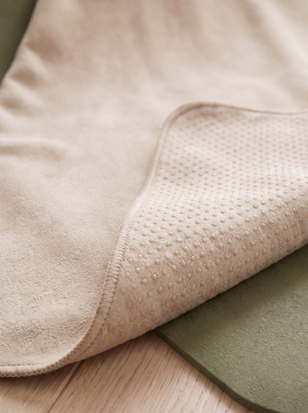 Close-up of the silicone grip dots on the underside of the yoga mat towel