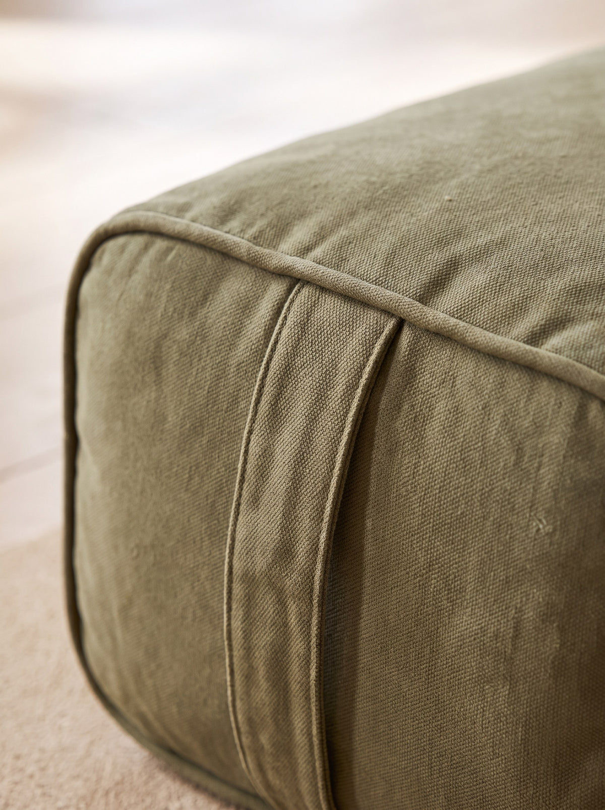 Close-up of the piped edge, zip and carry handle of the yoga bolster cover